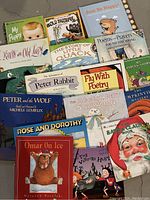 Photo showing the cover artwork and titles of 16 children’s books in a collection.