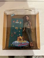 Front view of original packaging showing Chelsea doll next to teal My Scene locker with stickers on door.