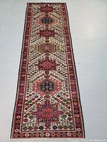 Full view of narrow runner showing field medallions and border