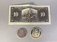1937 Canadian $10 banknote face and reverse, two commemorative coins including 2011 Xmas Tree coin with Swarovski Elements and 1964 centennial coin