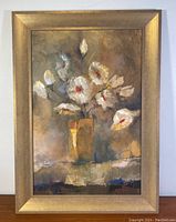 Full image of framed print depicting white flowers in a yellow vase; frame shows minor wear.