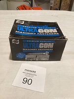 Box of UltraCon Premium Quality Masonry Fasteners with visible front branding and slight wear.