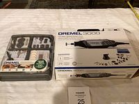 Dremel 3000 boxed rotary tool and accessory kit in unopened packaging on a table.