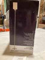 Box showing the lamp's picture and specifications on dark background