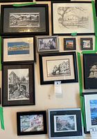 Overview photo of all ten framed prints showing varied subjects, colors, and frame styles