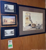 Overview of the four framed prints showing Saskatchewan grain elevators in various artistic styles and color schemes