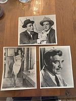 Photo showing Elizabeth Taylor holding a glass wearing a slip dress, Clark Gable headshot, and a photo of two men in hats and suits.
