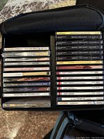 Overview of multiple CD jewel cases arranged in a CD holder, showing classical music titles including Beethoven string quartets and other composers.