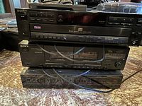 Sony 5-disc CD changer, Sony cassette deck and Star Trak Video Cipher II stacked