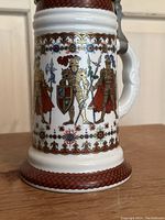 Front view showing knights in armor with shields and decorative borders at base.