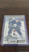 Front of Auston Matthews NHL Journey card numbered 649/899, showing him in Toronto Maple Leafs uniform with branding and serial number.