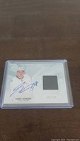 Full view of Greg Nemisz hockey card with autograph and jersey patch in plastic holder.