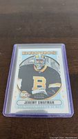 Front of Jeremy Swayman rookie card by O-Pee-Chee Platinum showing player image in Bruins uniform with RC logo.