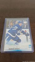 Front photo of Rasmus Sandin YoungGuns rookie hockey card showing player in Maple Leafs uniform with YoungGuns label.