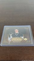 Front of Sidney Crosby rookie card showing player image and card title.