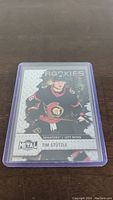 Front side of Tim Stutzle rookie card showing player image and 'ROOKIES' text with Ottawa Senators logo.