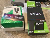 Original box containing Pretor HPR-100 headphones and EVGA GeForce GTX 1660 Super graphics card box with installation guide visible.