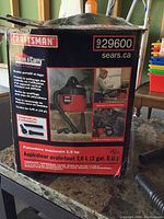 Box image showing Craftsman branding, model 929600, and product information including 2 gallon (7.6 liter) capacity and maximum power 2.5 hp.