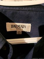 Photo of shirt label showing brand Balmain Paris and size 17 34/35.