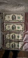 Four $2 Federal Reserve Notes, District 12 (San Francisco), green seals, sequential serial numbers