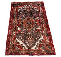 Full view of the Persian Zanjan rug showing overall pattern and colors.