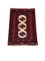 Full view of rectangular Turkmen backrest rug with central beige panel containing three repeating diamond-shaped guls surrounded by red and burgundy patterned borders with geometric motifs and fringes on the short ends.