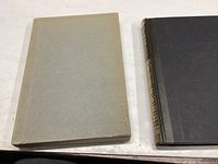 Top view of the book in its protective slipcase, showing the case exterior and book cover edge.