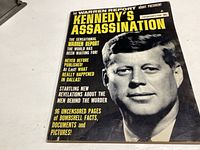 Cover of the booklet 'The Warren Report Kennedy's Assassination' showing President John F. Kennedy's portrait with text describing the content.