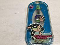 Sealed Powerpuff Girls Buttercup watch in original plastic packaging with blue starry backing and logo.
