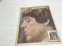 Front cover of vintage Beatles Yesterday sheet music with Paul McCartney profile image.
