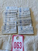 Eighteen packs of cubic zirconia gems labeled 'First Gem', each indicating round shape, size 3.25 mm, quantity 20 pcs.