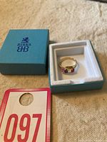Ring inside Birks box with auction lot number tag 097 visible