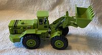 Side view of lime green Terex 72-71 wheel loader model showing overall condition and tire details.