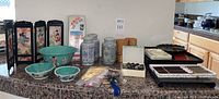 Overview of entire lot on countertop including screens, bowls, canisters, cups, trays, chopsticks and accessories