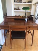 Front view of desk, chair and lamp