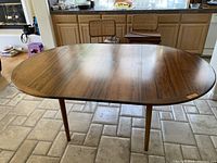 Full view of table in closed position showing shape and finish