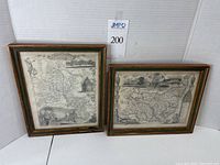 Two framed maps (Oxfordshire and Suffolk) shown side by side, both black and white with vintage wooden frames.