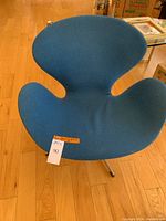 Front-top view showing seat shape and blue upholstery