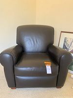 Front view of black leather recliner chair