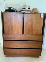 Front view of closed wardrobe/dresser showing two top doors and three bottom drawers