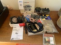 Overview of Jensen FR300 box, JVC headphones, Audio-Technica stylus, Bose and generic remotes