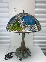 Front view of entire lamp showing shade pattern, base, cord, and pull chains.