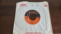 Photo of ABBA Dancing Queen 45rpm vinyl record on Atlantic label in WEA Music of Canada paper sleeve