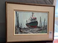Framed full view of the acrylic painting showing boat on dock scene and signature.