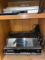 Top shelf showing Winthrop stereo receiver with turntable and 8-track player