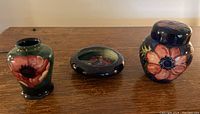 All three Moorcroft pieces displayed together