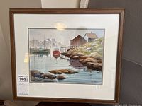 Full framed painting showing the coastal scene with boats, rocks and buildings, with seller tag present.