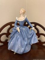 Front view of the Royal Doulton Fragrance figurine in blue dress with detailed floral pattern.