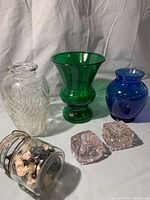 Six glass items displayed including 3 vases, 1 jar with chess pieces, and 2 inkwells