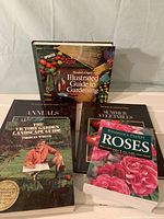 Five gardening books including Reader's Digest Illustrated Guide, Victory Garden Landscape, Time-Life Gardener's Guides on Summer Vegetables and Annuals, and Botanical's Pocket Roses.